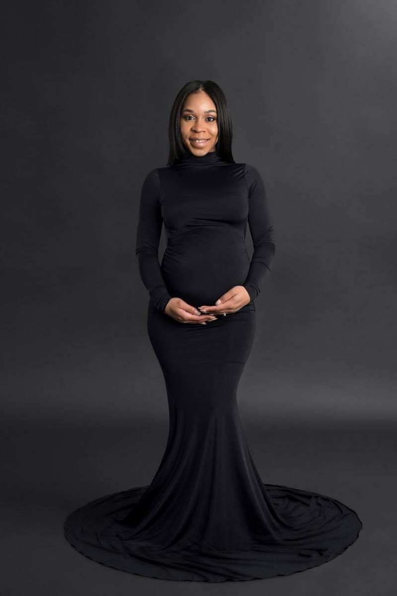 Pregnant in a black long dress