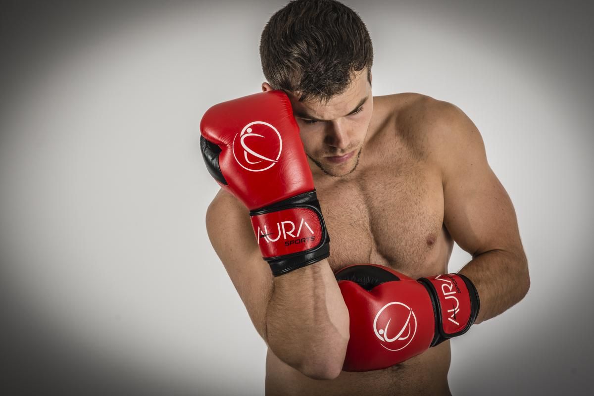 Boxer posing in block with red gloves sport photography