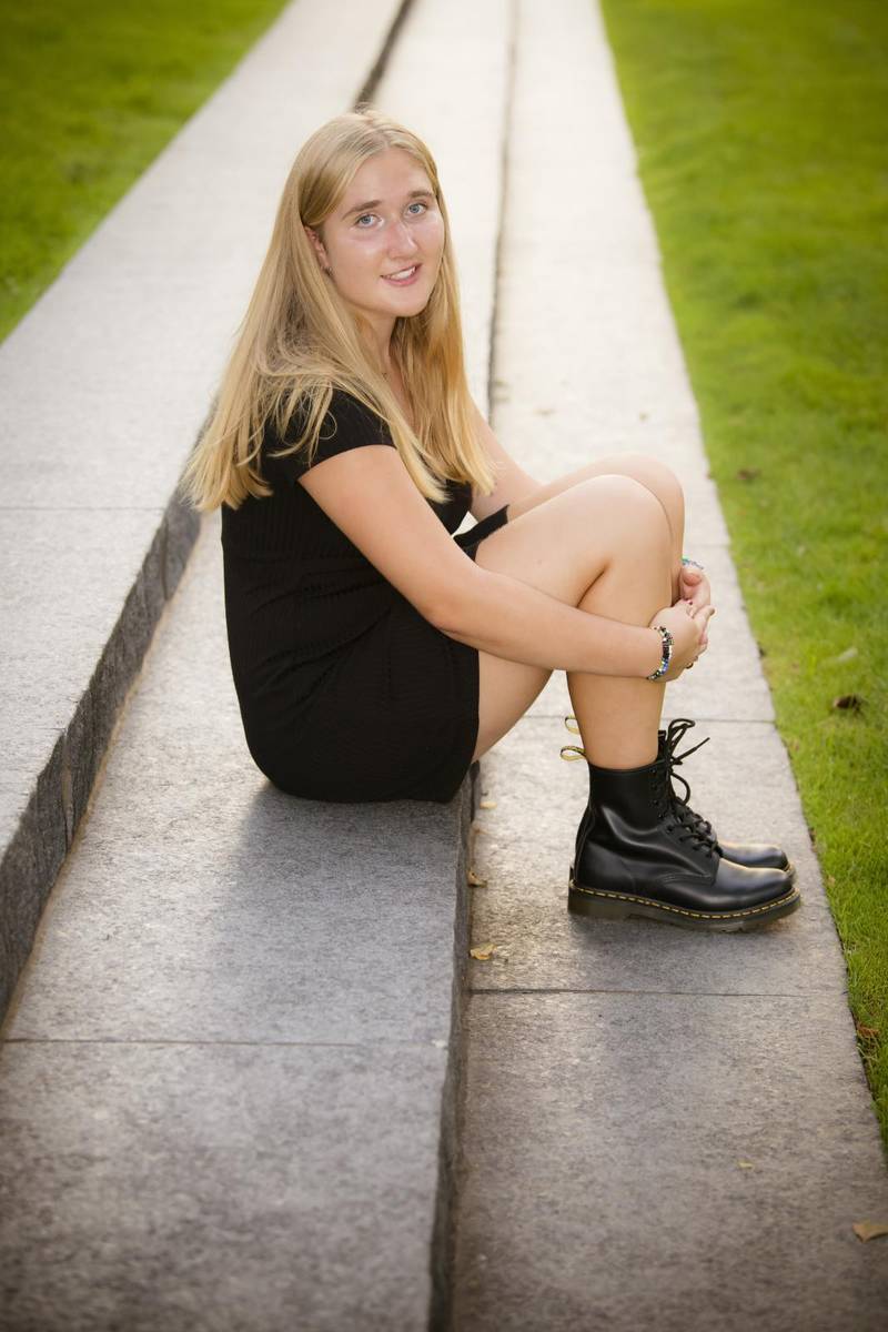 Girl sitting on school stairs