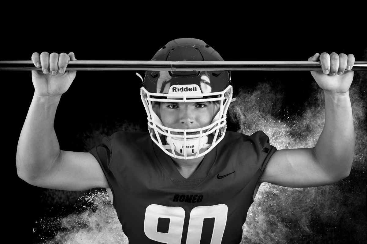 high school football player black and white photo