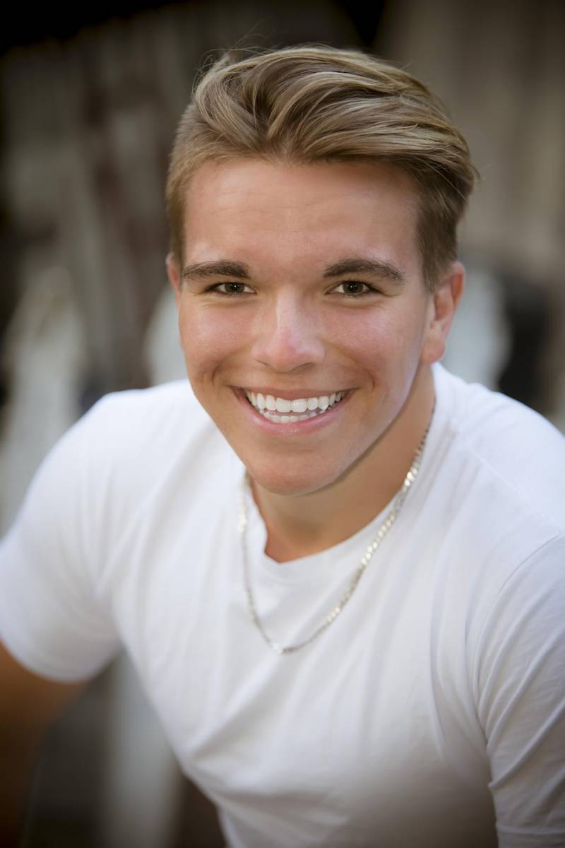 Smiling young man in a white t shirt