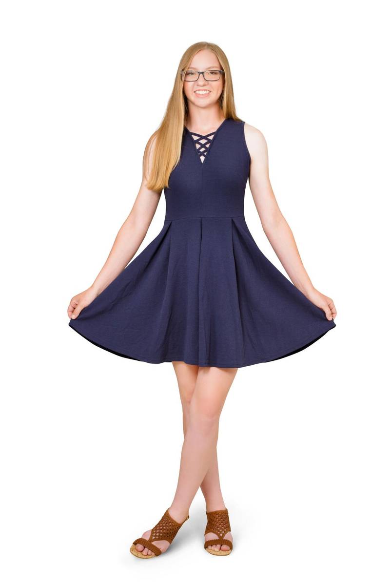 Studio shooting of senior school girl dressed in blue beautiful dress